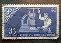 Old postage stamp from Romania circa 1958 shows a worker