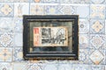 Old postcard of paris in a frame on the wall in a cafe Royalty Free Stock Photo