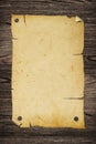 Old poster on wooden wall. Royalty Free Stock Photo