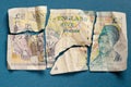 Old 5 pounds paper note torn apart