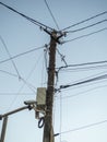 Old power line. New street camera on an old pole. Electricity supply to the population in Asia Royalty Free Stock Photo