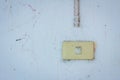 Old power switch on a dirty wall. Royalty Free Stock Photo