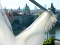 Old Prague city view through the wedding dress