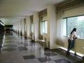 Old Presidential Palace hallway with woman, Vietnam Royalty Free Stock Photo