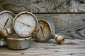 Old pressure gauge on wooden background and empty area for text, damage gauge from operation oil and gas production process Royalty Free Stock Photo