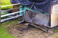 Primitive mechanical agricultural hand tools at fence on farm