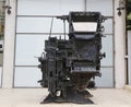 An old printing press machine being exhibited in the entrance of the Journalistic Center in Tel Aviv Royalty Free Stock Photo