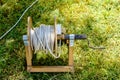 Old prolongation electric cable on green grass in the park Royalty Free Stock Photo