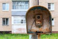 Old public russian wired urban telephone post - useless abandoned and broken. Royalty Free Stock Photo