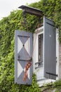 Old pulley on an apartment building Royalty Free Stock Photo