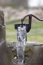 Old pump used to extract water from the field in Turkey. Royalty Free Stock Photo