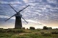 Old pump windmill in English countryside landscape early morning Royalty Free Stock Photo