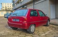 Old purple red Citroen AX parked