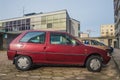 Old purple red Citroen AX parked