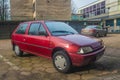 Old purple red Citroen AX parked