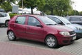 Old purple red Fiat Punto private compact car parked Royalty Free Stock Photo