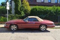 Old purple red Jaguar convertible coupe side view