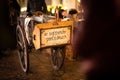 Old pushcart on a historic street with cobblestones paving at a christams fair