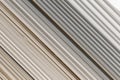 Old PVC plastic panels in a pile of building used recycling construction material. Texture background with lines and stripes Royalty Free Stock Photo