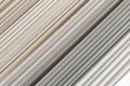 Old PVC plastic panels in a pile of building used recycling construction material. Texture background with lines and stripes Royalty Free Stock Photo