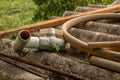 Old PVC Valve with Plastic Water Pipe/ Hose on Dirty Corrugated Roof - Moldy Concrete Texture Royalty Free Stock Photo