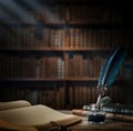 Old quill pen with an inkwell, papers and books on a table against an old bookshelf. Concept on the theme of history, education, Royalty Free Stock Photo