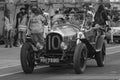 Old racing car and spectators Royalty Free Stock Photo