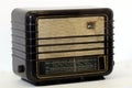 Retro radio device on a gray and white background 