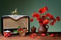 Old radio and red poppies in a ceramic vase Royalty Free Stock Photo