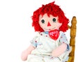 Old rag doll with heart lollipop