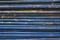 Old ragged metal rusty blue building pipes in a heap. rough surface texture Royalty Free Stock Photo