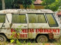 An old, ragged, mossy ambulance emergency