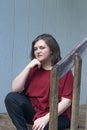 Old railing near posing pretty girl in spring Royalty Free Stock Photo