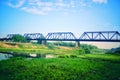 Old railroad tracks on Black Bridge or Lampang Railway Bridge. Railway bridge on river at Lampang thailand Royalty Free Stock Photo