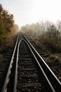 Old railroad tracks leading through the bridge. Railway line in Central Europe Royalty Free Stock Photo