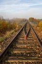 Old railroad tracks leading through the bridge. Railway line in Central Europe Royalty Free Stock Photo