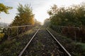 Old railroad tracks leading through the bridge. Railway line in Central Europe Royalty Free Stock Photo