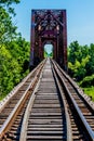 Old Railroad Trestle with an Old Iconic Iron Truss Bridge Royalty Free Stock Photo