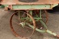 An old railroad Wagon sits on steel wheels.