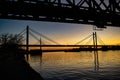 Old railway bridge and sunset over sava river Royalty Free Stock Photo