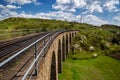 Old railway stone viaduct in the spring in sunny day