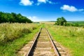 Old railway track among fields Royalty Free Stock Photo