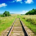 Old railway track among fields Royalty Free Stock Photo