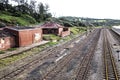 Old Railway Tracks with Dilapidated Unused Brick Buildings Royalty Free Stock Photo