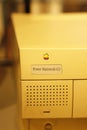 Old rainbow Apple logo on old Macintosh computer.