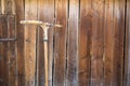 Old rake on the background of the wooden barn, Ukraine Royalty Free Stock Photo