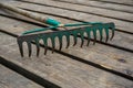 Old rake on the wooden planks Royalty Free Stock Photo
