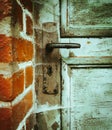 Old ramshackle wooden door with cobwebs Royalty Free Stock Photo