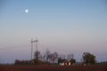 Old ranch, barn and moon in sunset Royalty Free Stock Photo