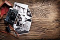 Old rangefinder camera and black-and-white photos. Royalty Free Stock Photo